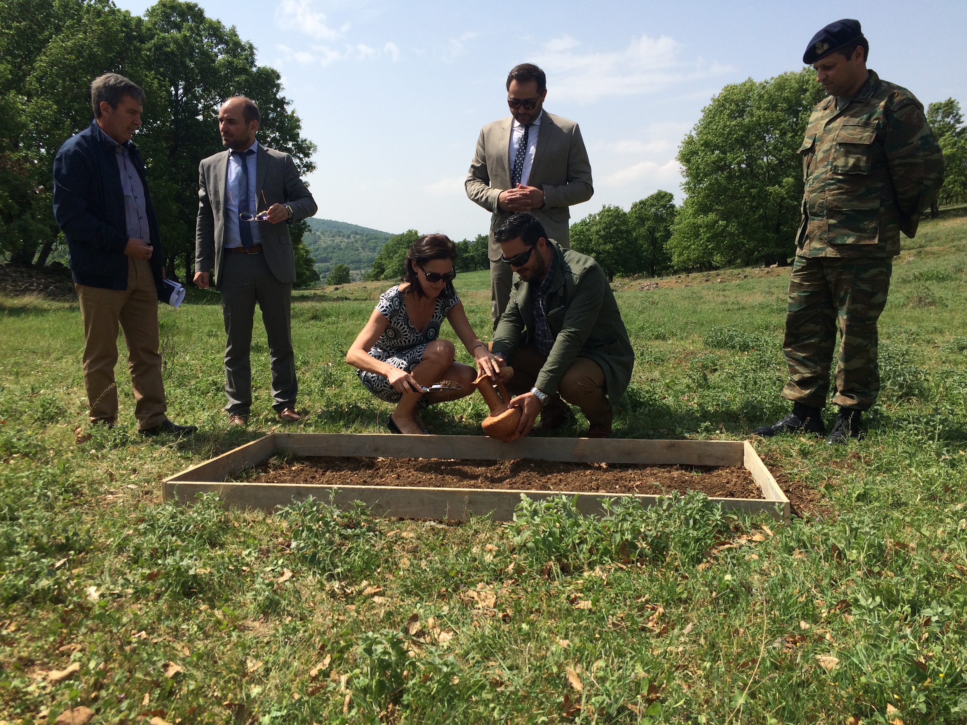 Mr Christos Bardakas, Deputy Mayor; Mr Nikolaos Doumtsis, Deputy Mayor; and Mr Petros Seridis, President of the Municipal Council collecting soil with local dignitaries in Bouzania, near to Vevi Pass, Greece.