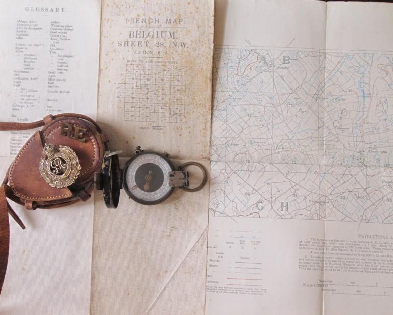 A 1917  trench map of the Ypres salient 1:20,000, British military prismatic compass and  First World War Royal Engineers cap badge and RE shoulder title