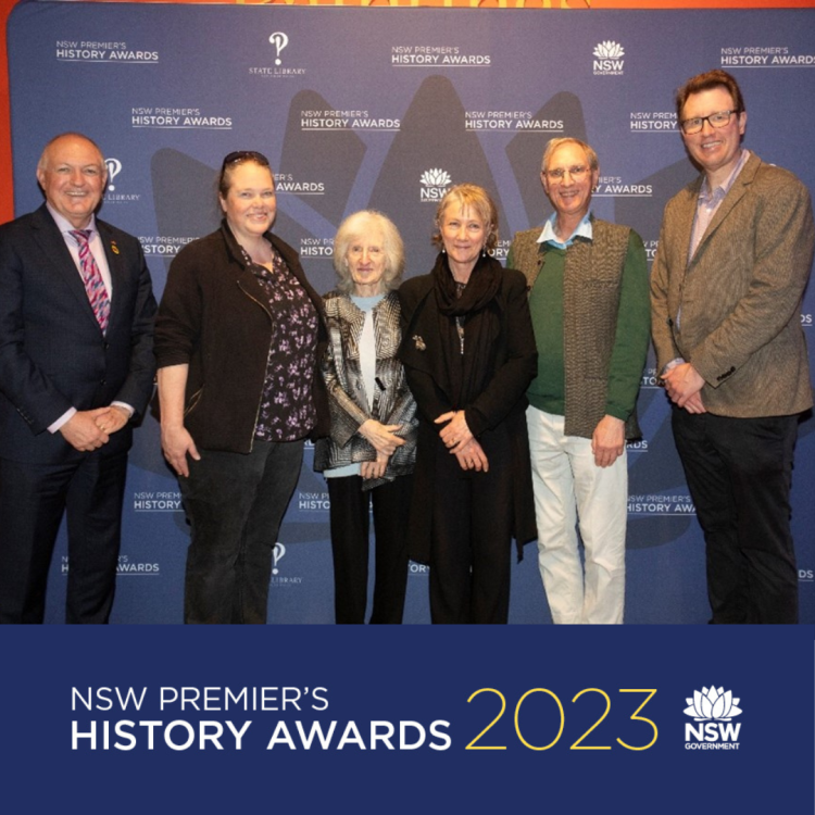 June Factor (centre left) with The Hon David Harris, Director OVA Caroline Mackaness, and Military History Prize judges Professor Peter Stanley, Dr Michael Molkentin and Miesje de Vogel. Photo by Gene Ramirez, State Library of NSW.