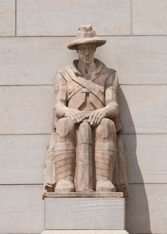 Photograph of the Ammunition Carrier buttress sculpture on the Memorial's facade