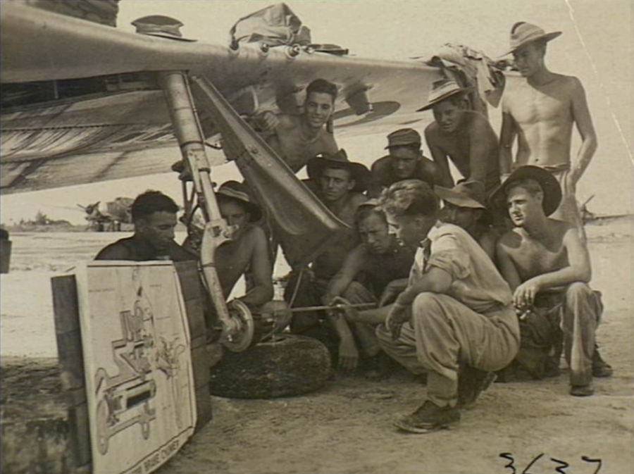 Original caption reads: “Finer maintenance points of the wheel assembly of a Mustang aircraft are explained by Sergeant Bill Hogarty of Cronulla, NSW. The men are members of No. 81 (Fighter) Wing, RAAF, which will represent RAAF in the occupation forces in Japan”, 3 November 1945. AWM OG3637