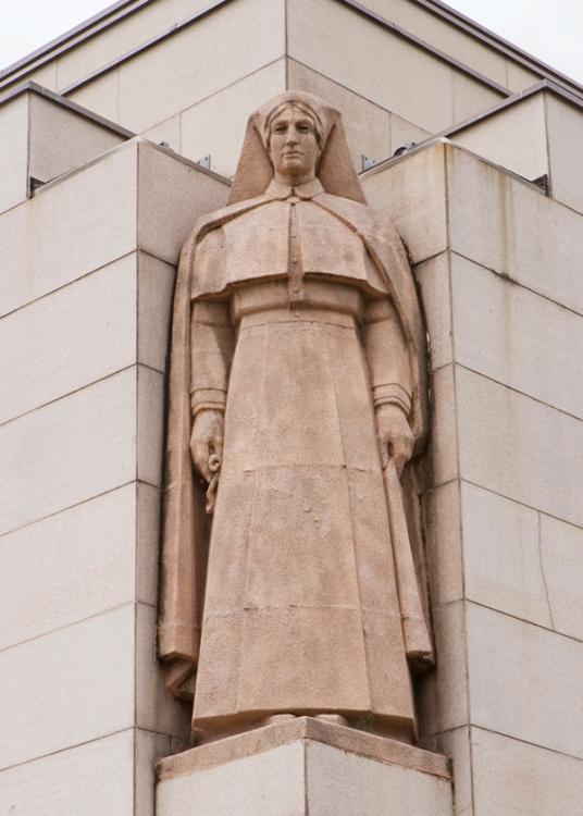 Photograph of the Matron sculpture on the Memorial's facade