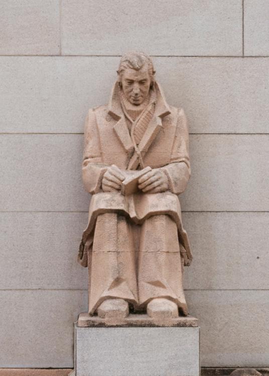 Photograph of the Naval Wireless Signaller buttress sculpture on the Memorial's facade