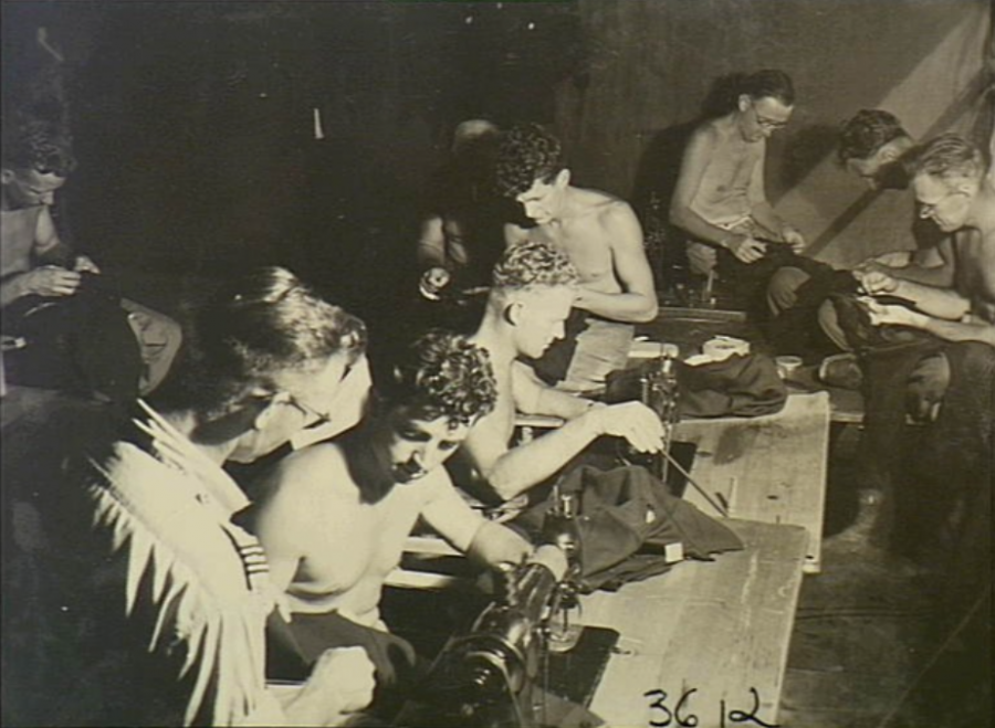 Tailors sew the distinctive blue uniforms to be worn by No. 81 Wing, RAAF, during their service in Japan, Labuan Island, North Borneo, October 1945. AWM OG3612. 